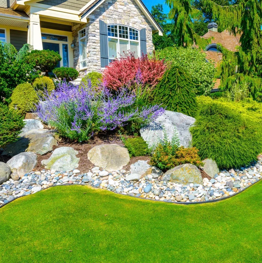 Finished Kelson yard renovation with lawn, planting beds and decorative rock