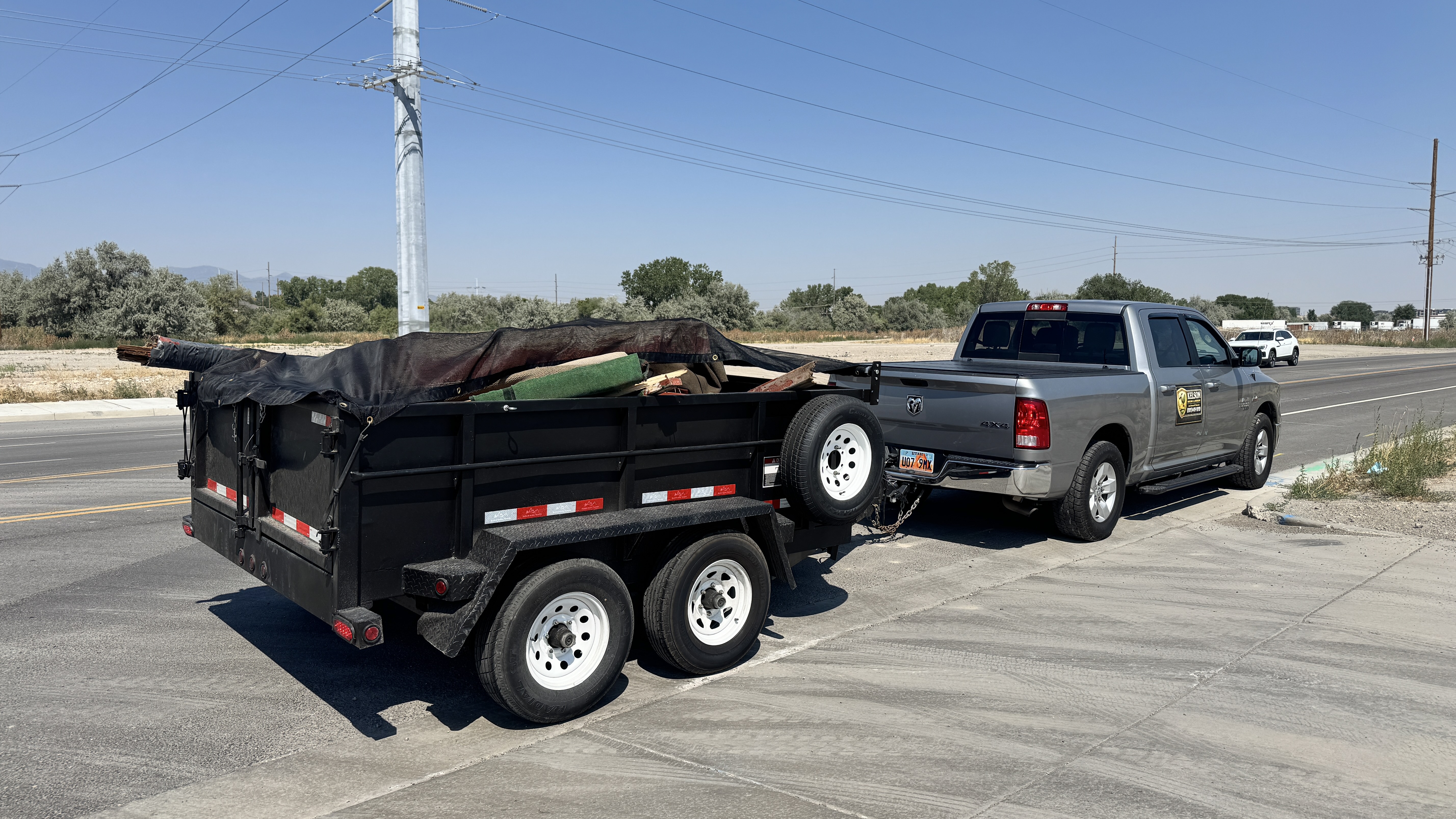 Kelson Hauling & Landscape truck and dump trailer ready for a cleanout project in the Salt Lake Valley